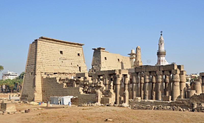 The pylon and colonnade of Luxor Temple, with the minaret of the Abu Haggag mosque above