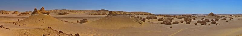 Wind-carved rock formations across the desert at Wadi El Hitan, Fayoum